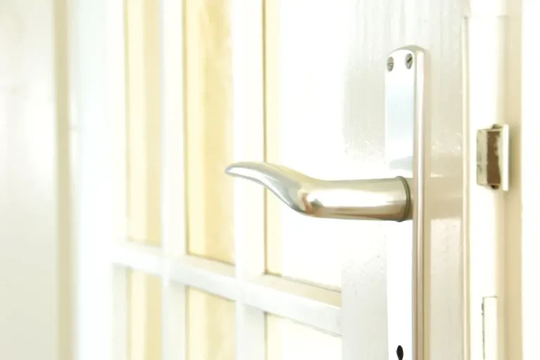 Lock repair or replacement in Normanton – white door with a lever handle and locking plate, Locksmith Normanton guide to which your door needs