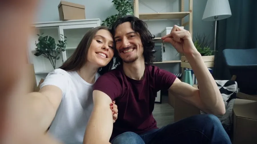 Couple holding up keys in their new home – residential locksmith Normanton help for homeowners from Locksmith Normanton